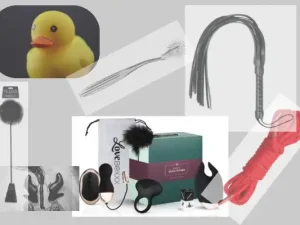 Coffret plaisir osé composé de sextoys pour couple du Domaine d'Angély : sextoy vibrant, œuf de plaisir et accessoires présentés dans un écrin moderne avec éclairage d'ambiance violet.